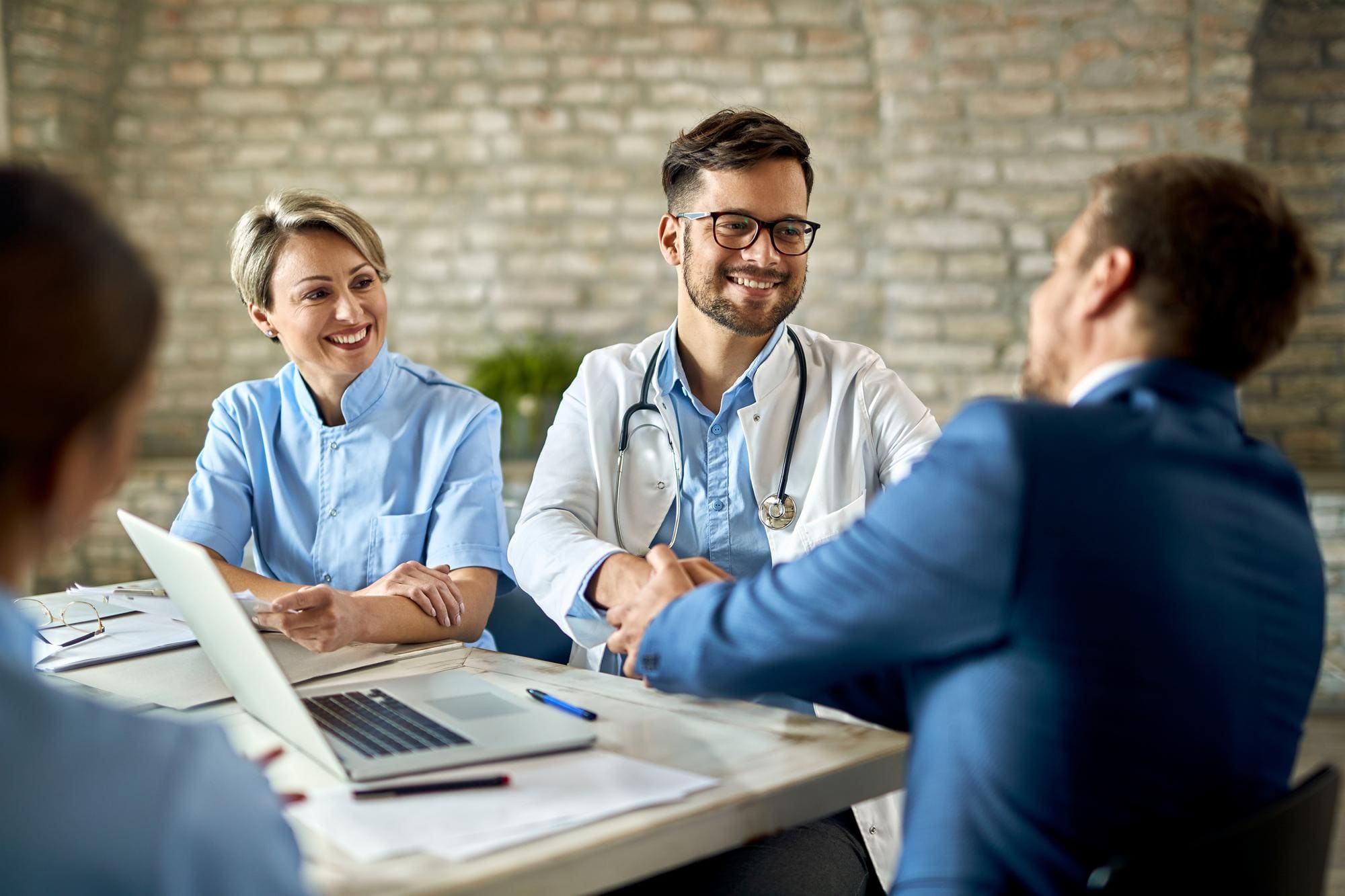 Pharma partnership handshake